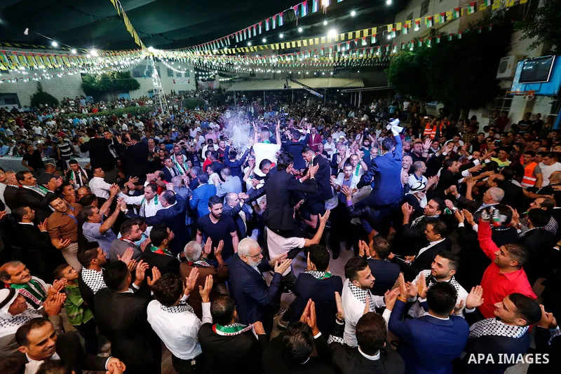 Palestinians dance during a mass wedding funded by Palestinian President Mahmoud Abbas in the West Bank village of Tafouh, east of Hebron, on August 10, 2017. Photo by Wisam Hashlamoun