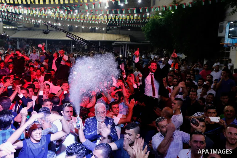 Palestinians dance during a mass wedding funded by Palestinian President Mahmoud Abbas in the West Bank village of Tafouh, east of Hebron, on August 10, 2017. Photo by Wisam Hashlamoun