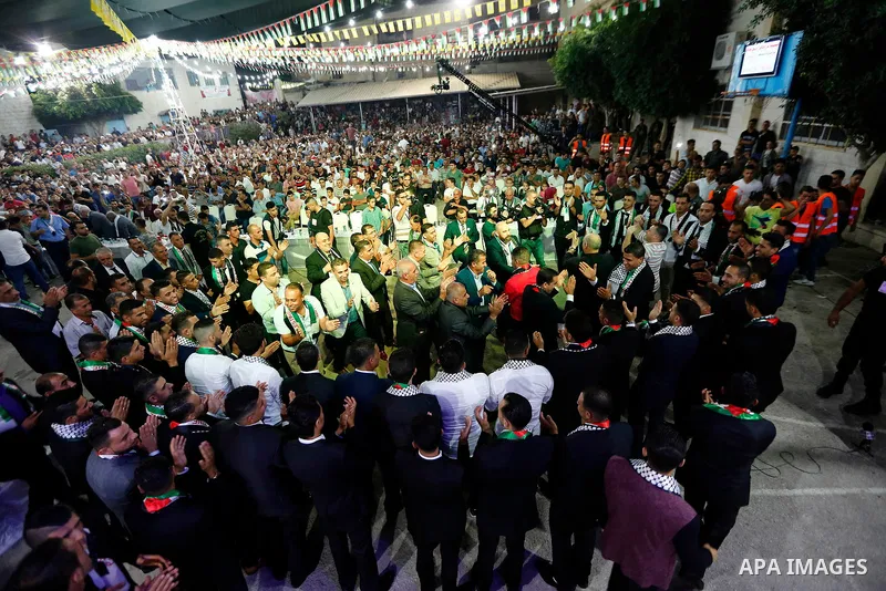 Palestinians dance during a mass wedding funded by Palestinian President Mahmoud Abbas in the West Bank village of Tafouh, east of Hebron, on August 10, 2017. Photo by Wisam Hashlamoun