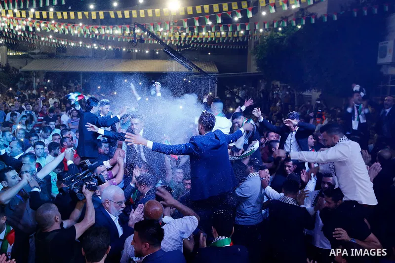Palestinians dance during a mass wedding funded by Palestinian President Mahmoud Abbas in the West Bank village of Tafouh, east of Hebron, on August 10, 2017. Photo by Wisam Hashlamoun