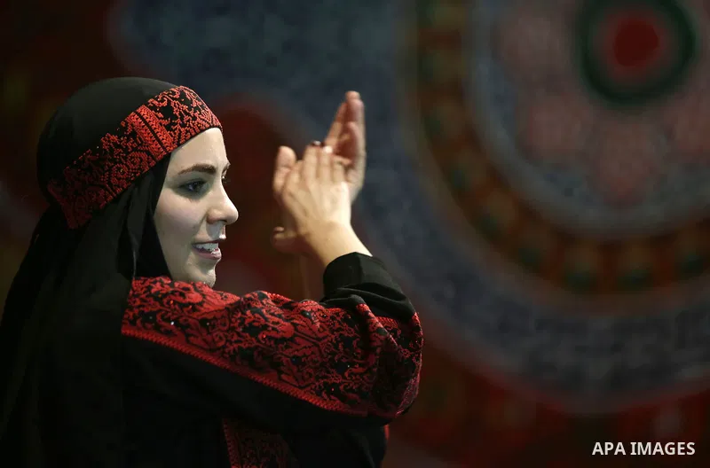 Members of Palestinian dance Dabka band perform during a mass wedding ceremony for 65 couples funded by Palestinian President Mahmoud Abbas at Al-Fara refugee camp near the West Bank city of Nablus, on August 10, 2017. P...