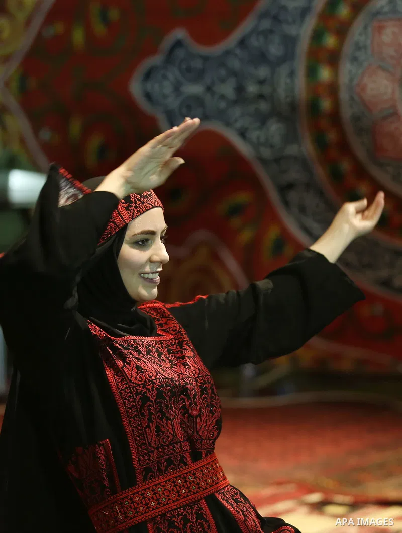 Members of Palestinian dance Dabka band perform during a mass wedding ceremony for 65 couples funded by Palestinian President Mahmoud Abbas at Al-Fara refugee camp near the West Bank city of Nablus, on August 10, 2017. P...