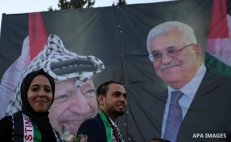 Palestinian 65 couples take part in a mass wedding ceremony funded by Palestinian President Mahmoud Abbas at Al-Fara refugee camp near the West Bank city of Nablus, on August 10, 2017. Photo by Ayman Ameen
