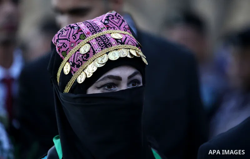 Palestinian 65 couples take part in a mass wedding ceremony funded by Palestinian President Mahmoud Abbas at Al-Fara refugee camp near the West Bank city of Nablus, on August 10, 2017. Photo by Ayman Ameen
