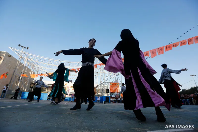 Palestinian youth perform traditional Palestinian dance during the Festival of the movement of Palestinian National Initiative Mustafa Barghouti in West Bank city of Bethlehem on August 12, 2017. Photo by Wisam Hashlamou...