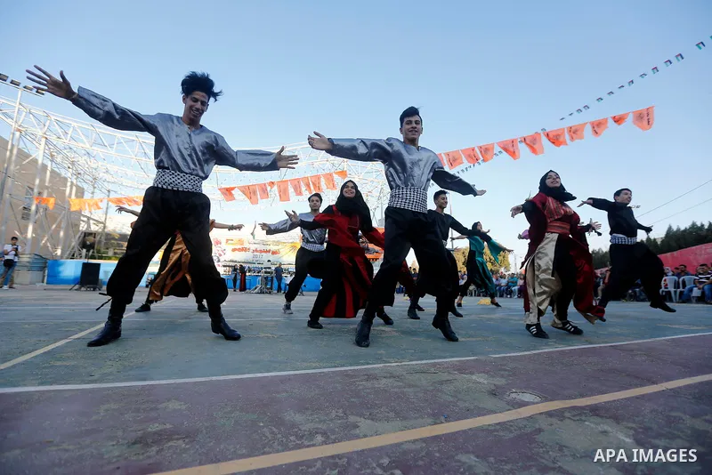 Palestinian youth perform traditional Palestinian dance during the Festival of the movement of Palestinian National Initiative Mustafa Barghouti in West Bank city of Bethlehem on August 12, 2017. Photo by Wisam Hashlamou...