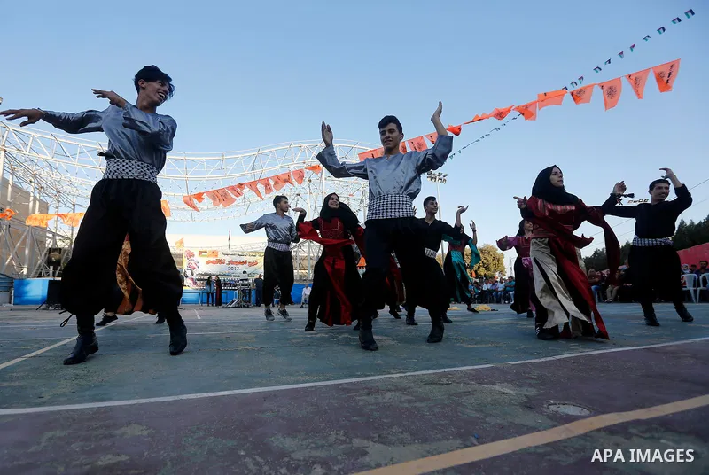 Palestinian youth perform traditional Palestinian dance during the Festival of the movement of Palestinian National Initiative Mustafa Barghouti in West Bank city of Bethlehem on August 12, 2017. Photo by Wisam Hashlamou...