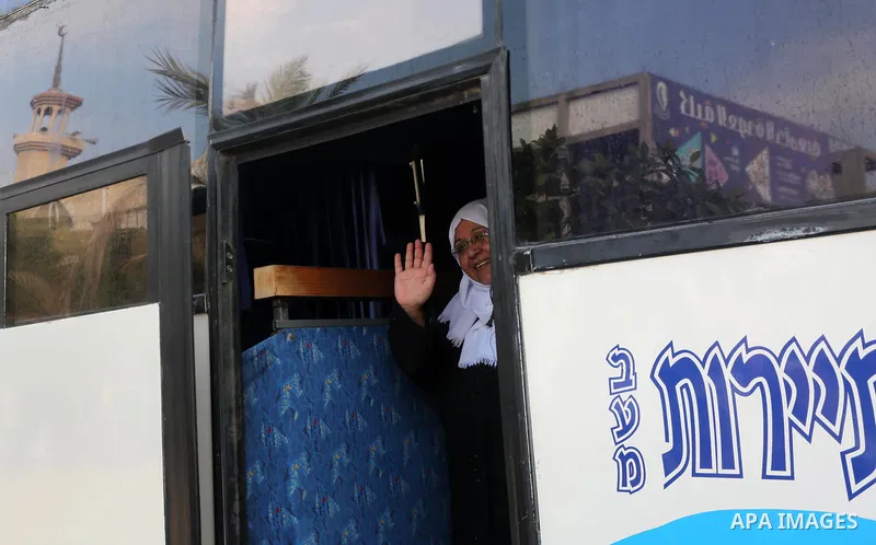 Palestinian Muslim pilgrims wave towards their relatives before leaving for the annual haj pilgrimage to the holy city of Mecca, in Gaza city on August 14, 2017. Photo by Mohammed Asad