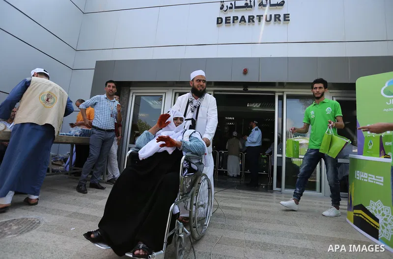Palestinian Muslim pilgrims arrive at the Rafah border crossing between Egypt and the southern Gaza Strip, on August 14, 2017, ahead of their departure to the annual Hajj pilgrimage in Saudi Arabia's holy city of Mecca....