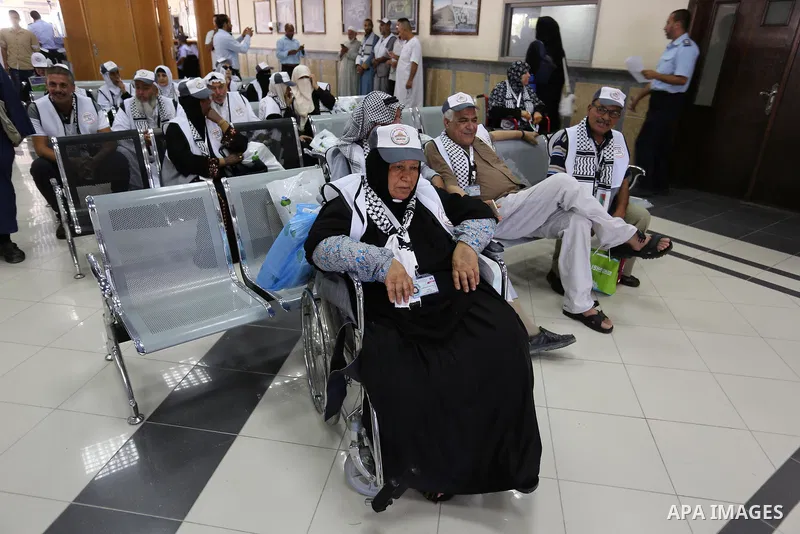 Palestinian Muslim pilgrims arrive at the Rafah border crossing between Egypt and the southern Gaza Strip, on August 14, 2017, ahead of their departure to the annual Hajj pilgrimage in Saudi Arabia's holy city of Mecca....