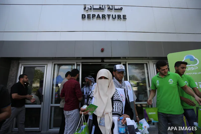 Palestinian Muslim pilgrims arrive at the Rafah border crossing between Egypt and the southern Gaza Strip, on August 14, 2017, ahead of their departure to the annual Hajj pilgrimage in Saudi Arabia's holy city of Mecca....
