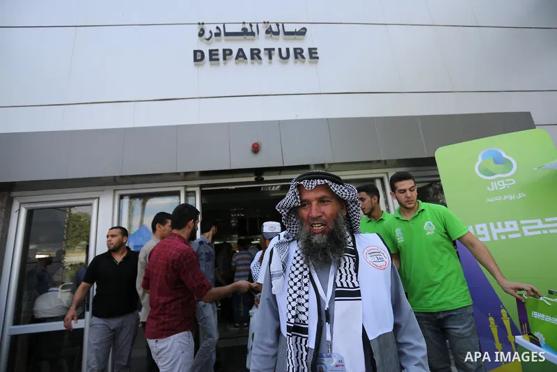 Palestinian Muslim pilgrims arrive at the Rafah border crossing between Egypt and the southern Gaza Strip, on August 14, 2017, ahead of their departure to the annual Hajj pilgrimage in Saudi Arabia's holy city of Mecca....