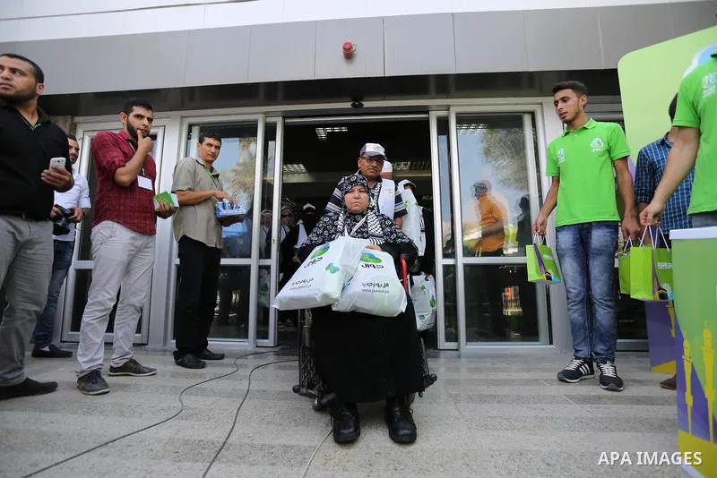 Palestinian Muslim pilgrims arrive at the Rafah border crossing between Egypt and the southern Gaza Strip, on August 14, 2017, ahead of their departure to the annual Hajj pilgrimage in Saudi Arabia's holy city of Mecca....