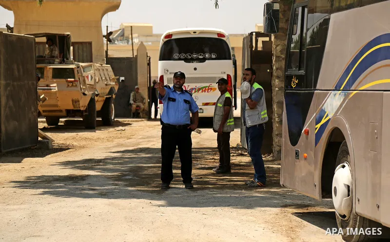 Egyptian security forces stand guard at the border as Palestinian Muslim pilgrims arrive at the Rafah crossing between Egypt and the southern Gaza Strip, on August 14, 2017, ahead of their departure to the annual Hajj pi...
