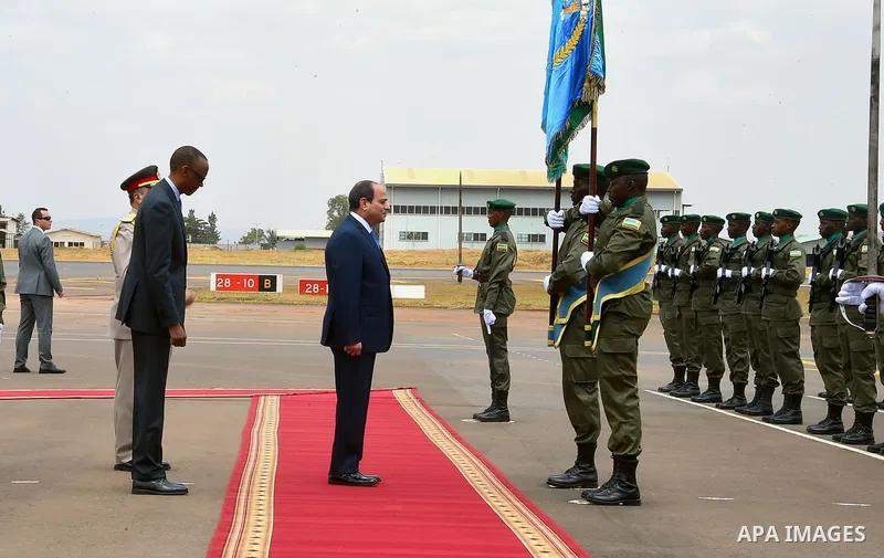 Egyptian President Abdel Fattah al-Sisi and Rwandan President Paul Kagame inspect a guard of honour after al-Sisi's arrival at Kigali International Airport on August 15, 2017. The Egyptian President is paying a two day v...