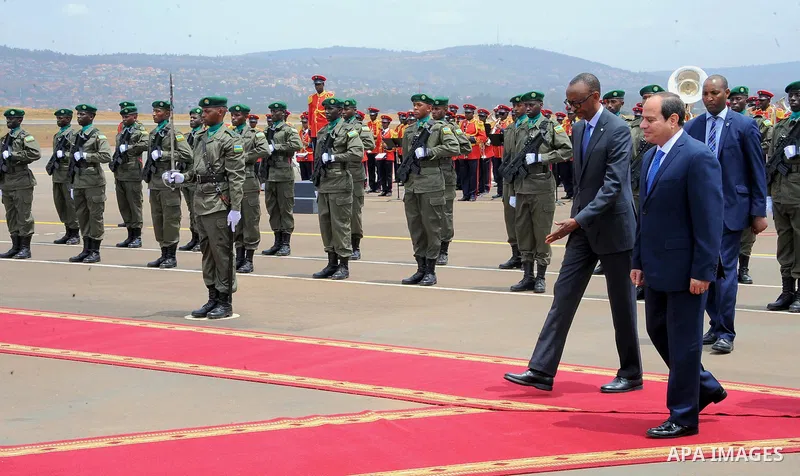 Egyptian President Abdel Fattah al-Sisi walks alongside with Rwandan President Paul Kagame inspect a guard of honour after al-Sisi's arrival at Kigali International Airport on August 15, 2017. The Egyptian President is p...