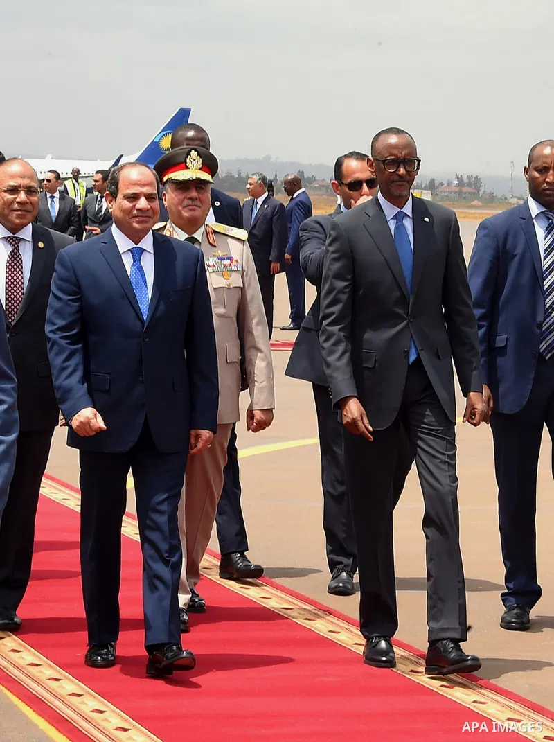 Egyptian President Abdel Fattah al-Sisi walks alongside with Rwandan President Paul Kagame inspect a guard of honour after al-Sisi's arrival at Kigali International Airport on August 15, 2017. The Egyptian President is p...