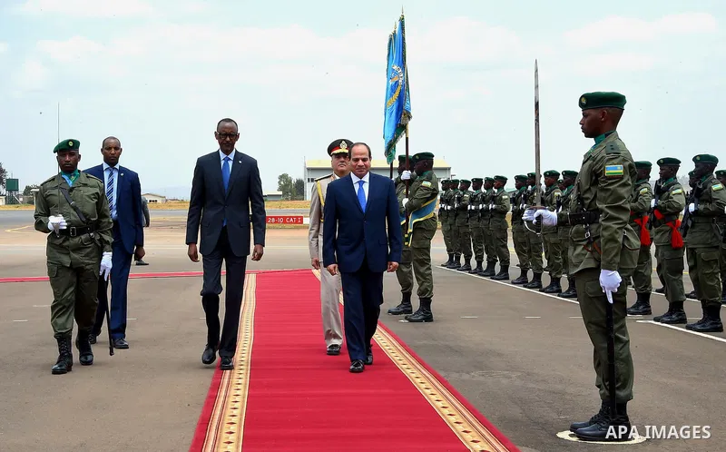 Egyptian President Abdel Fattah al-Sisi and Rwandan President Paul Kagame inspect a guard of honour after al-Sisi's arrival at Kigali International Airport on August 15, 2017. The Egyptian President is paying a two day v...
