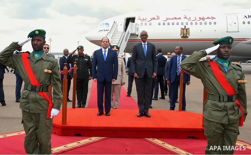 Egyptian President Abdel Fattah al-Sisi and Rwandan President Paul Kagame inspect a guard of honour after al-Sisi's arrival at Kigali International Airport on August 15, 2017. The Egyptian President is paying a two day v...