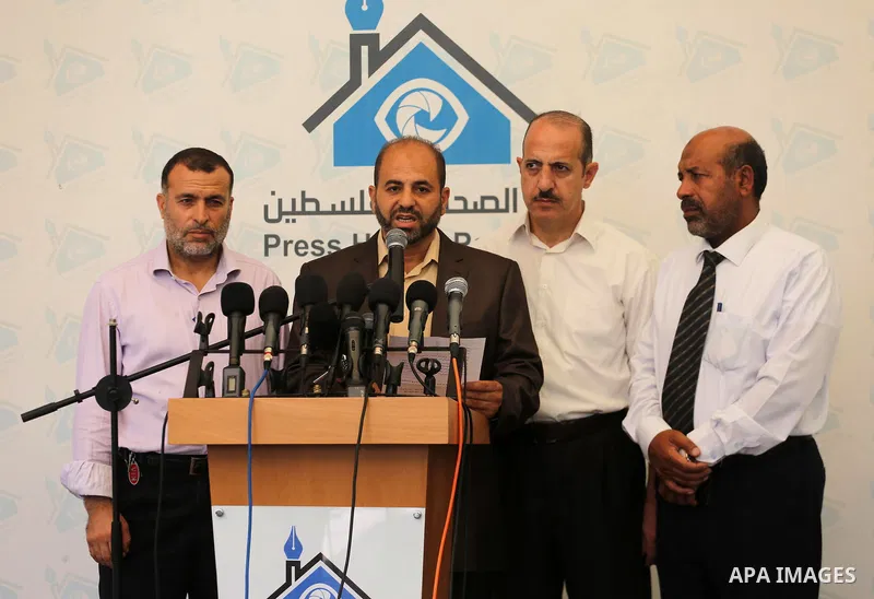 Head of the Popular Committee Moeen Abu Aoukal speaks during a press conference, in Gaza city, on August 16, 2017. Photo by Mohammed Asad