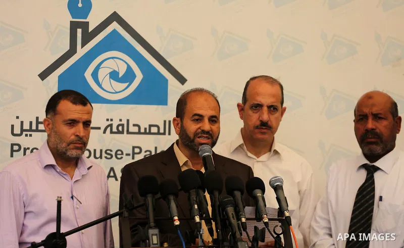 Head of the Popular Committee Moeen Abu Aoukal speaks during a press conference, in Gaza city, on August 16, 2017. Photo by Mohammed Asad