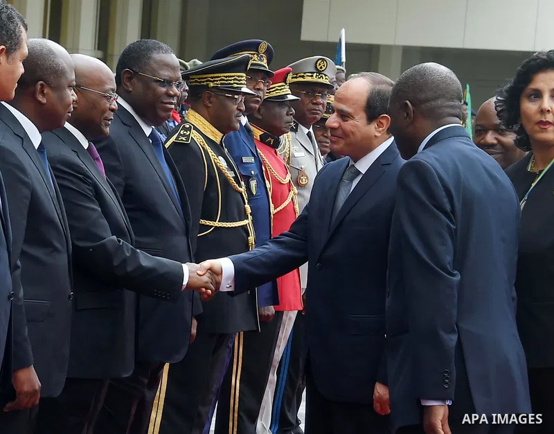Egyptian President Abdel Fattah al-Sisi shakes hands with Gabon's officials upon his arrive to Libreville the capital of Gabon, on August 16, 2017. Photo by Egyptian President Office