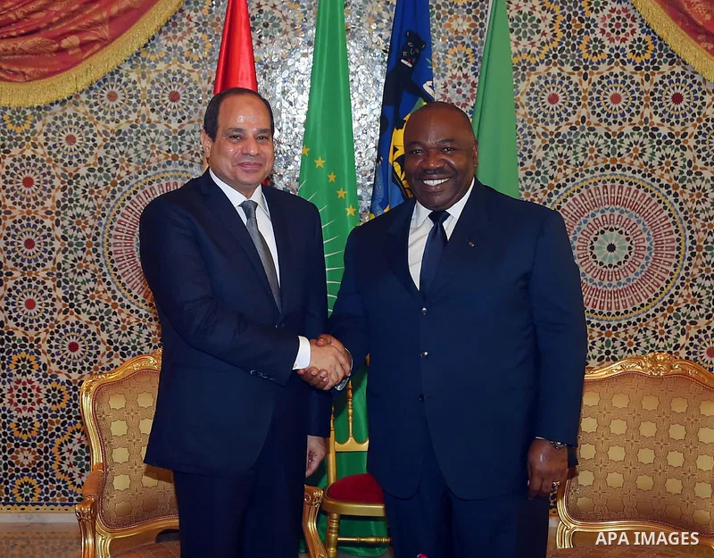 Egyptian President Abdel Fattah al-Sisi shakes hands with Gabon's President Ali Bongo Ondimba in Libreville on August 16, 2017. Photo by Egyptian President Office