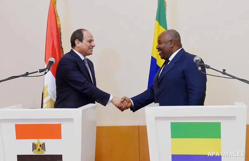 Egyptian President Abdel Fattah al-Sisi shakes hands with Gabon's President Ali Bongo following a joint press conference in Libreville on August 16, 2017. Photo by Egyptian President Office