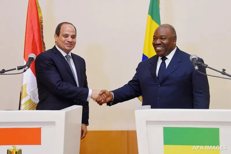 Egyptian President Abdel Fattah al-Sisi shakes hands with Gabon's President Ali Bongo following a joint press conference in Libreville on August 16, 2017. Photo by Egyptian President Office