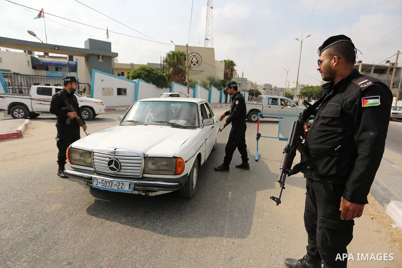 A Palestinian policeman searches a car, in Rafah in the southern of Gaza Strip August 17, 2017. A suicide bomber killed a Palestinian in southern Gaza, officials said, in what was seen as a rare Islamist attack against t...
