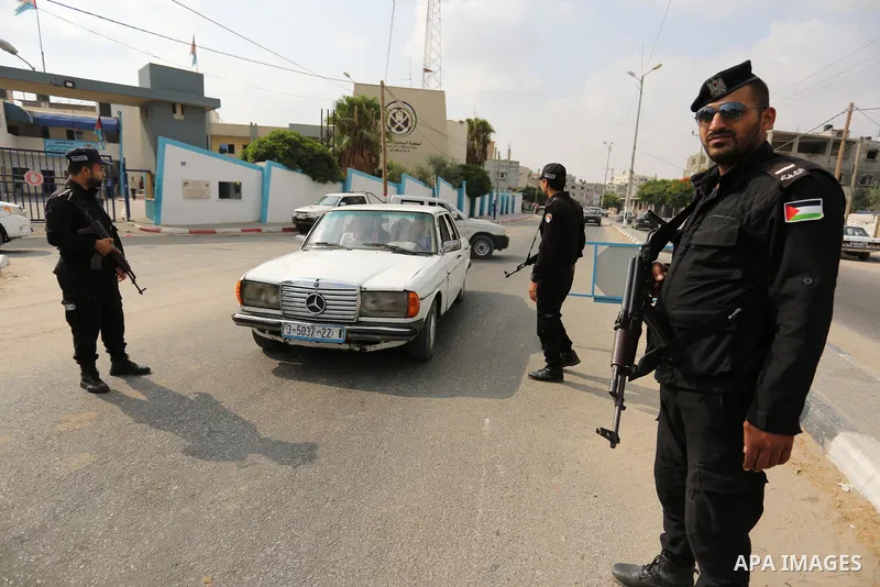 A Palestinian policeman searches a car, in Rafah in the southern of Gaza Strip August 17, 2017. A suicide bomber killed a Palestinian in southern Gaza, officials said, in what was seen as a rare Islamist attack against t...