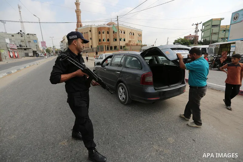 Palestinian policemen stop a vehicle at a security checkpoint, in Rafah in the southern of Gaza Strip August 17, 2017. A suicide bomber killed a Palestinian security man in southern Gaza, officials said, in what was seen...