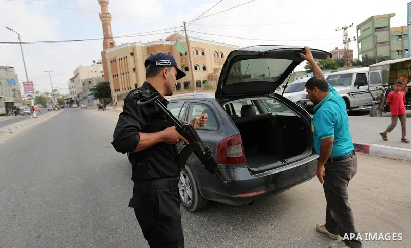 Palestinian policemen stop a vehicle at a security checkpoint, in Rafah in the southern of Gaza Strip August 17, 2017. A suicide bomber killed a Palestinian security man in southern Gaza, officials said, in what was seen...