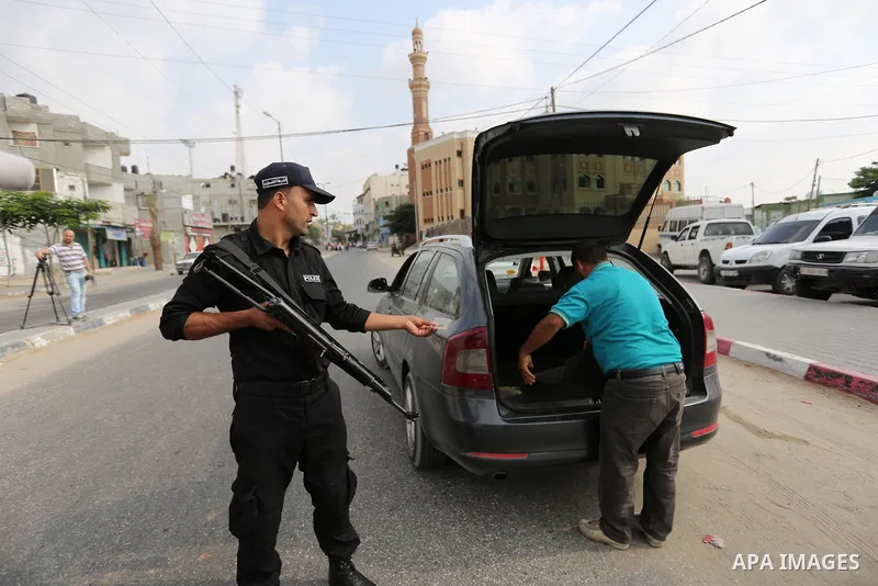 Palestinian policemen stop a vehicle at a security checkpoint, in Rafah in the southern of Gaza Strip August 17, 2017. A suicide bomber killed a Palestinian security man in southern Gaza, officials said, in what was seen...