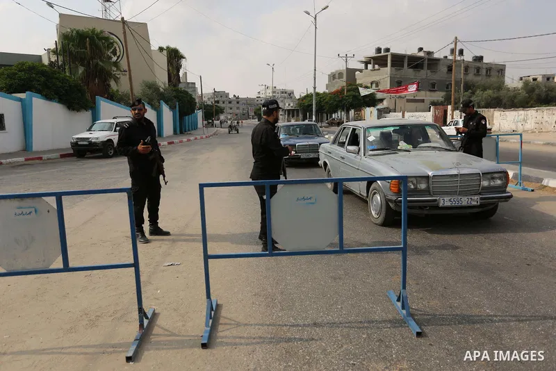 Palestinian policemen stop a vehicle at a security checkpoint, in Rafah in the southern of Gaza Strip August 17, 2017. A suicide bomber killed a Palestinian security man in southern Gaza, officials said, in what was seen...