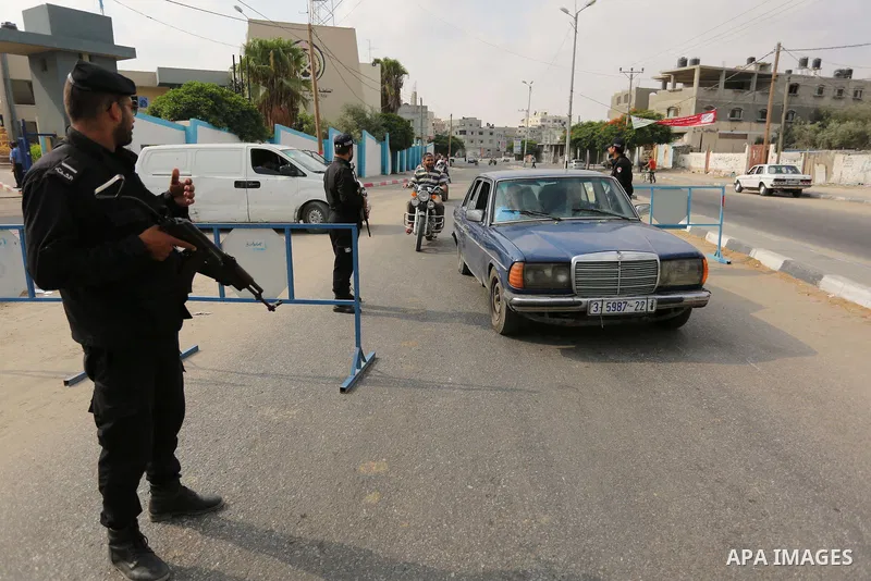 Palestinian policemen stop a vehicle at a security checkpoint, in Rafah in the southern of Gaza Strip August 17, 2017. A suicide bomber killed a Palestinian security man in southern Gaza, officials said, in what was seen...