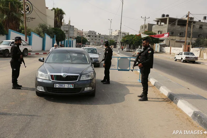 Palestinian policemen stop a vehicle at a security checkpoint, in Rafah in the southern of Gaza Strip August 17, 2017. A suicide bomber killed a Palestinian security man in southern Gaza, officials said, in what was seen...