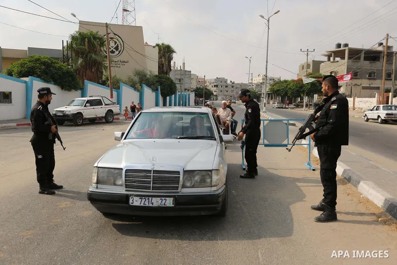 Palestinian policemen stop a vehicle at a security checkpoint, in Rafah in the southern of Gaza Strip August 17, 2017. A suicide bomber killed a Palestinian security man in southern Gaza, officials said, in what was seen...