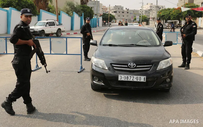Palestinian policemen stop a vehicle at a security checkpoint, in Rafah in the southern of Gaza Strip August 17, 2017. A suicide bomber killed a Palestinian security man in southern Gaza, officials said, in what was seen...