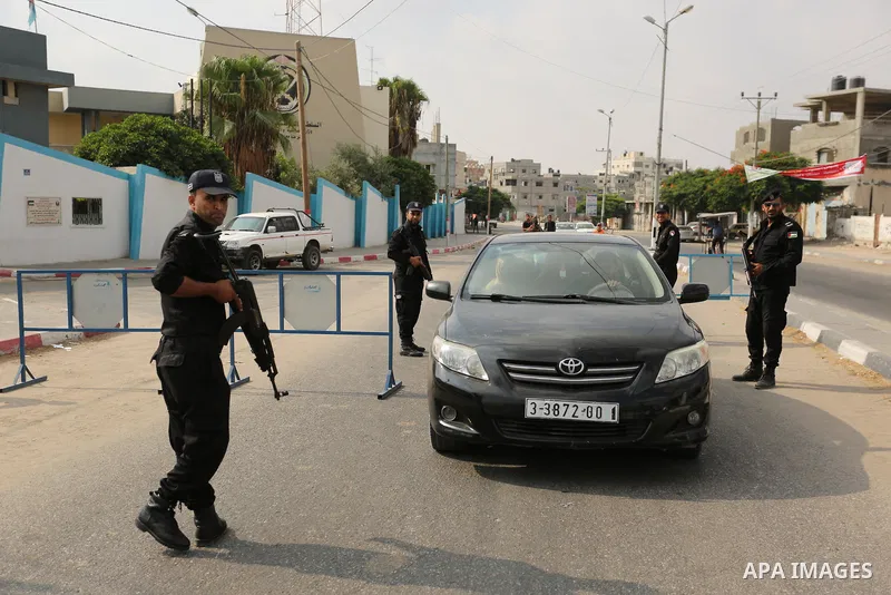 Palestinian policemen stop a vehicle at a security checkpoint, in Rafah in the southern of Gaza Strip August 17, 2017. A suicide bomber killed a Palestinian security man in southern Gaza, officials said, in what was seen...