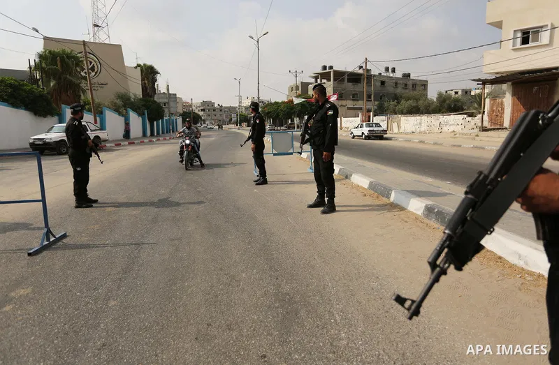 Palestinian policemen stop a vehicle at a security checkpoint, in Rafah in the southern of Gaza Strip August 17, 2017. A suicide bomber killed a Palestinian security man in southern Gaza, officials said, in what was seen...
