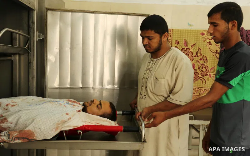 Relatives mourn over the body of Palestinian Nidal al-Jaafari, 38, at a hospital morgue in Rafah in the southern of Gaza Strip August 17, 2017. A suicide bomber killed a Palestinian security man in southern Gaza, officia...
