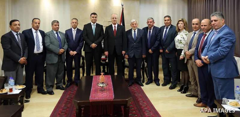 Palestinian Prime minister, Rami Hamadallah, meets with a Jordanian Minister of Agriculture Khalid Al Hanifat, in the West Bank city of Ramallah,on August 17, 2017. Photo by Prime Minister Office