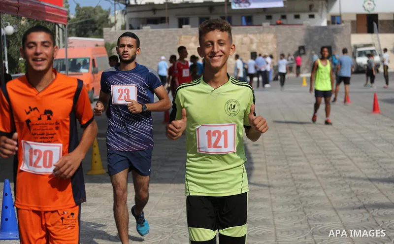 Palestinians take part in a marathon in Gaza City on August 17, 2017. Photo by Mohammed Asad
