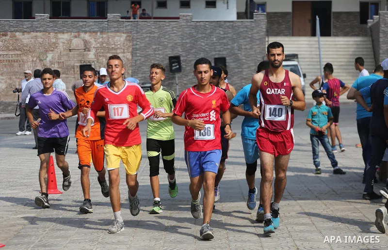 Palestinians take part in a marathon in Gaza City on August 17, 2017. Photo by Mohammed Asad