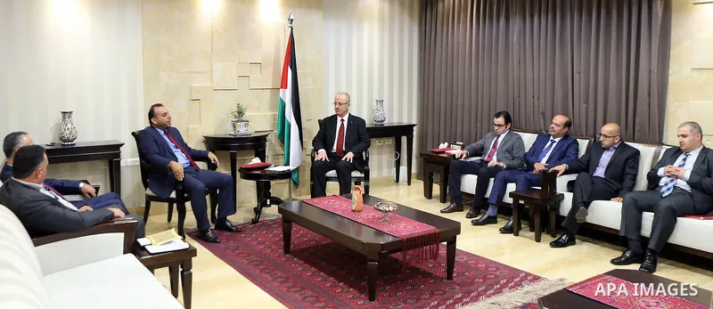 Palestinian Prime minister, Rami Hamadallah, meets with a Secretary-General of the General Federation of Palestinian Writers and Writers Murad Al-Sudani, in the West Bank city of Ramallah,on August 17, 2017. Photo by Pri...
