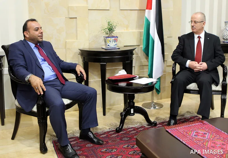 Palestinian Prime minister, Rami Hamadallah, meets with a Secretary-General of the General Federation of Palestinian Writers and Writers Murad Al-Sudani, in the West Bank city of Ramallah,on August 17, 2017. Photo by Pri...