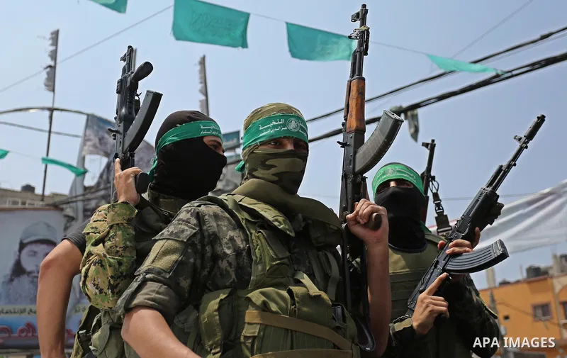 Palestinian Hamas militants attend the funeral of Nidal al-Jaafari, a 28-year-old field commander who was killed overnight in a suicide attack that targeted forces near the Gaza Strip's crossing with Egypt, in Rafah, sou...