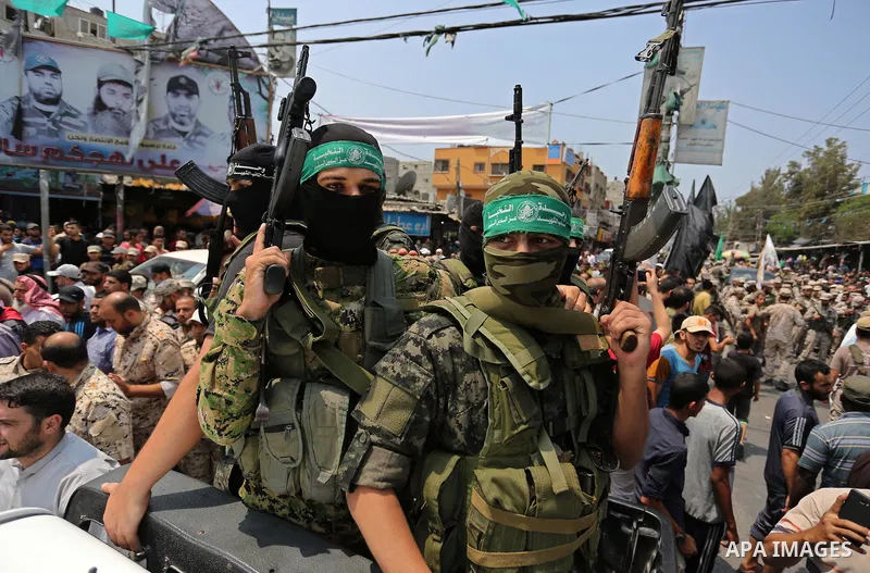 Palestinian Hamas militants attend the funeral of Nidal al-Jaafari, a 28-year-old field commander who was killed overnight in a suicide attack that targeted forces near the Gaza Strip's crossing with Egypt, in Rafah, sou...