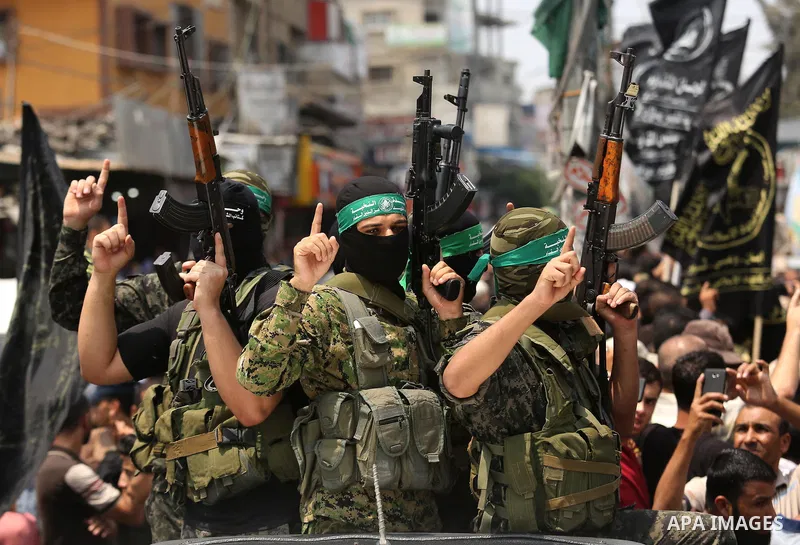 Palestinian Hamas militants attend the funeral of Nidal al-Jaafari, a 28-year-old field commander who was killed overnight in a suicide attack that targeted forces near the Gaza Strip's crossing with Egypt, in Rafah, sou...